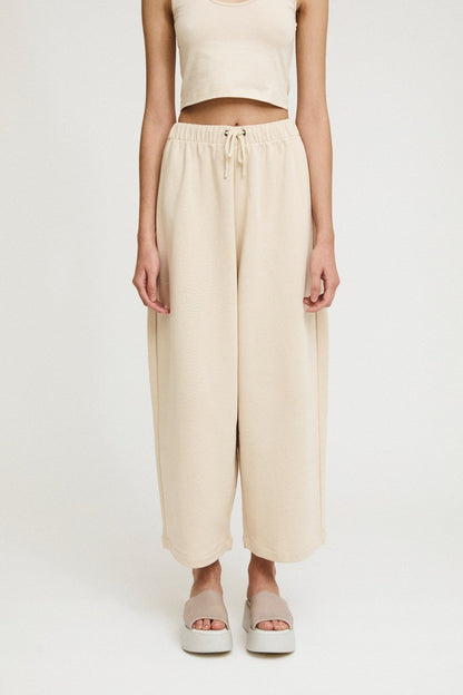 rita row wanda maxi pant / Curved cotton knit pants for all-day wear. High rise with elastic waistband with adjustable drawstring and curved leg. 100% organic cotton. Ethically made in Portugal.