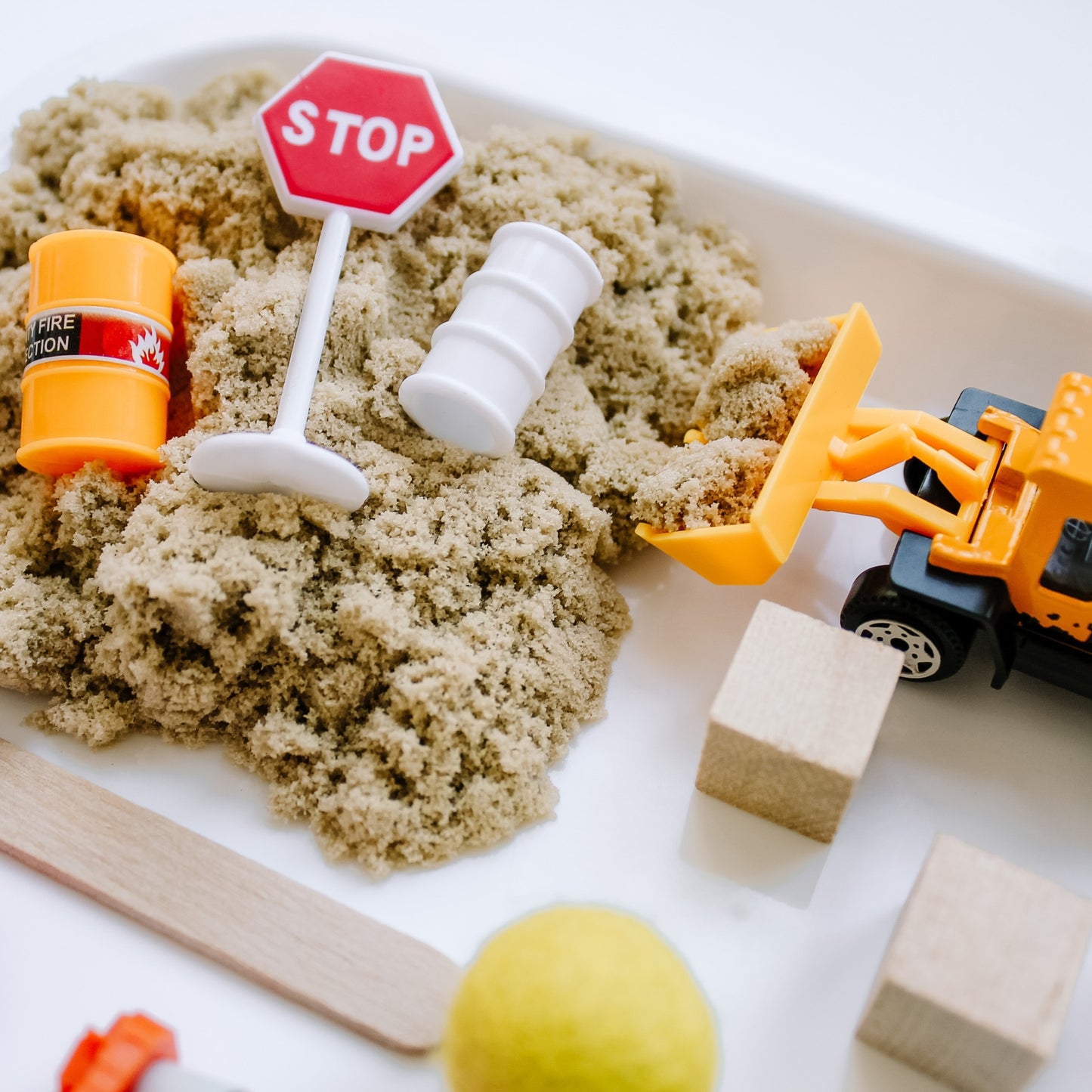 Dig, build, load, and explore with this Construction themed Kit. Little hands will love the opportunities for open-ended play as we explore the emotional skill of Perseverance through play. Includes 6 oz of hypoallergenic moldable sensory sand, mini wooden stick for scooping, and small parts for play.