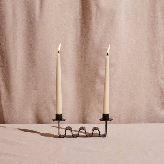 Wavy Black metal candle holder for two taper holders.

Designed by Diego Olivero.