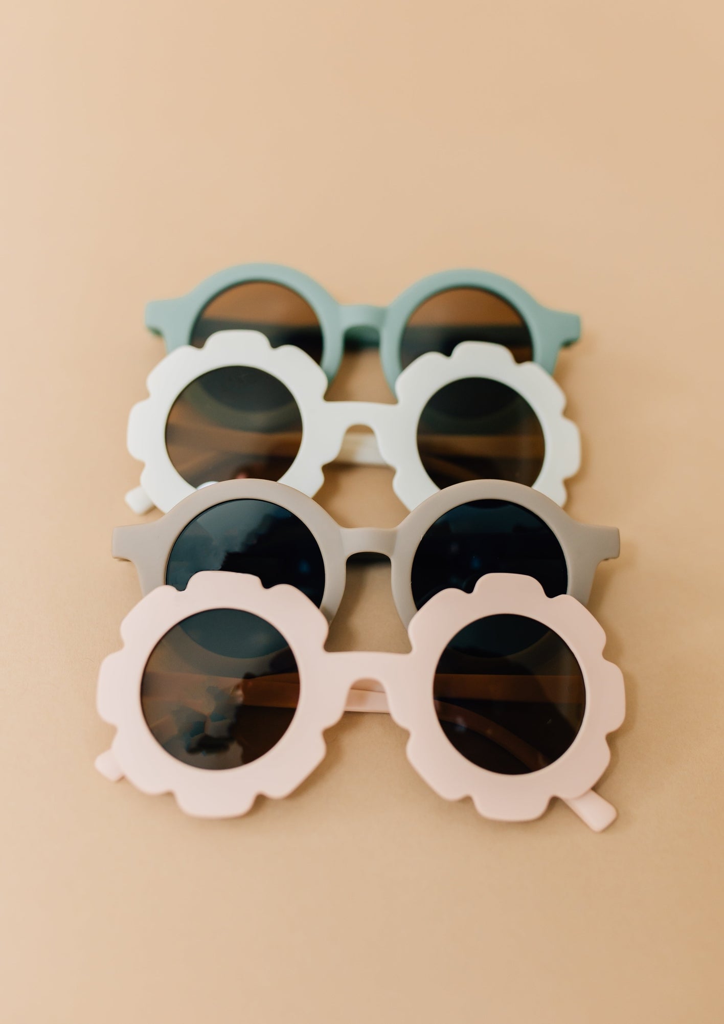 Kids sunglasses are made of recycled plastic and feature UV400 protection. They fit most toddlers and kids 12 months and up, but sizing will depend on the child's head size.&nbsp;