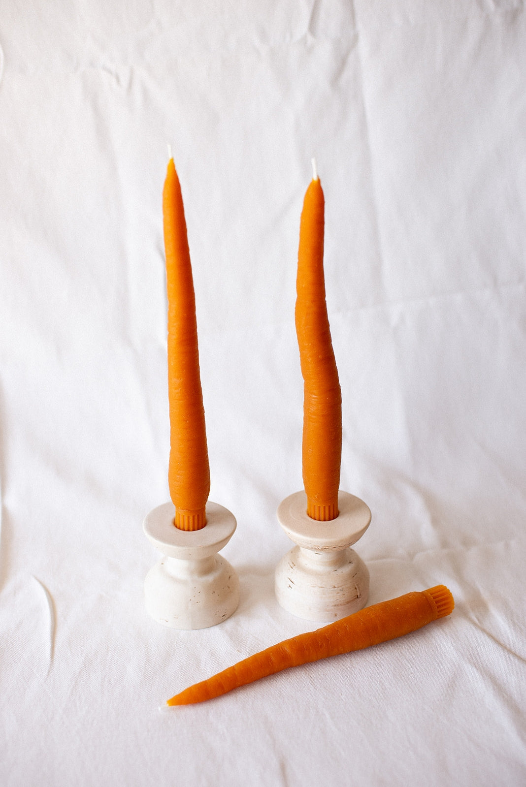 happy organics Beeswax tapers that have been meticulously shaped to resemble fresh carrots, these candles are a delightful fusion of artistry and nature. Made from pure beeswax, they emanate a natural, sweet aroma