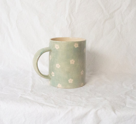 Handmade ceramic mug, hand painted and glazed with food safe ceramic materials.  The perfect mug to elevate your morning ritual. Hand-painted mint petunia pattern. Handmade in the US.