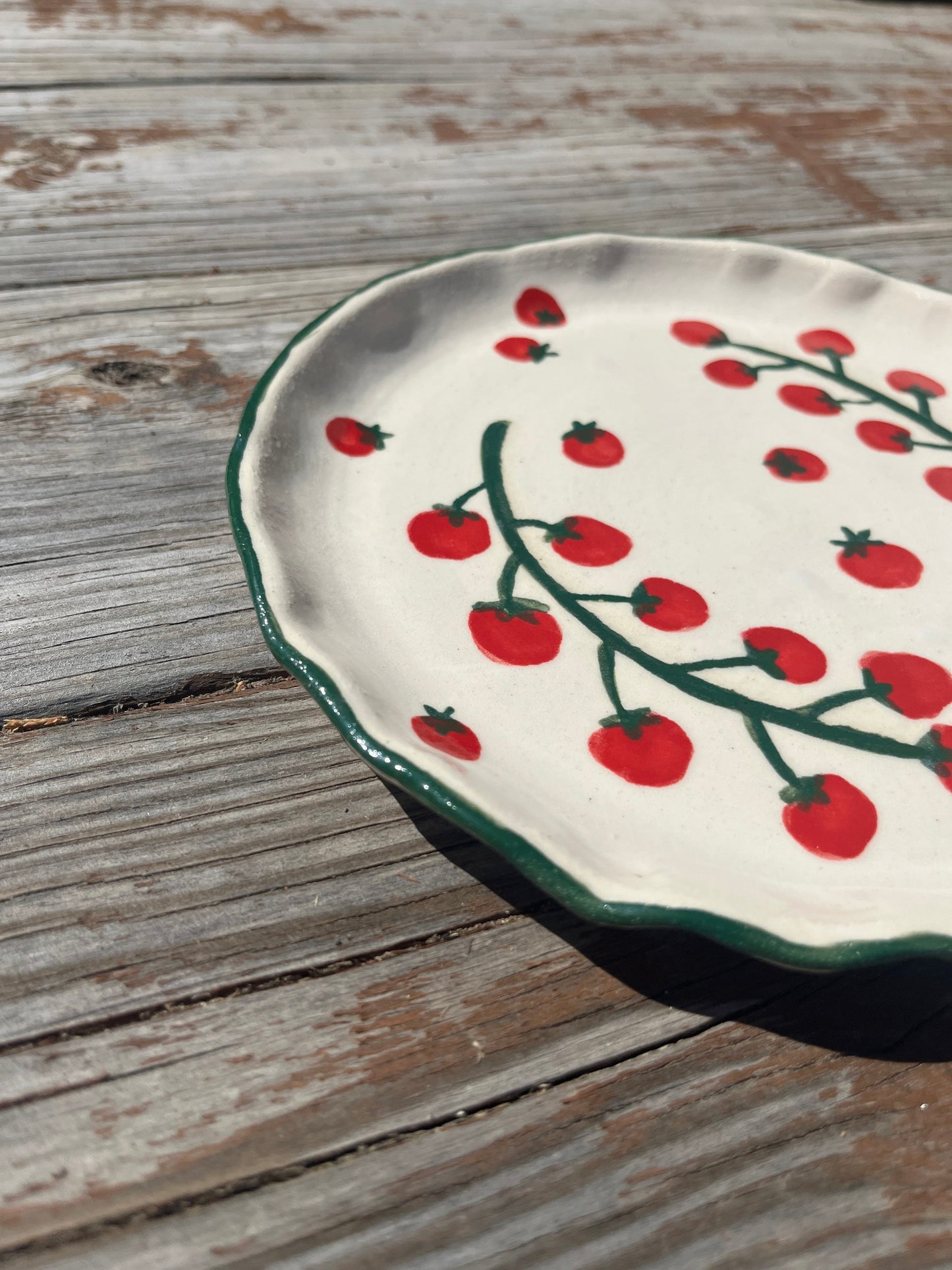 Cherry tomato salad/lunch plate by ninth house goods. A hand-painted lunch plate designed for your spring and summer gatherings. The perfect lunch or salad plate for your fresh harvests. Your new go-to to impress guests at your home. Wheel-thrown white clay with clear glaze.