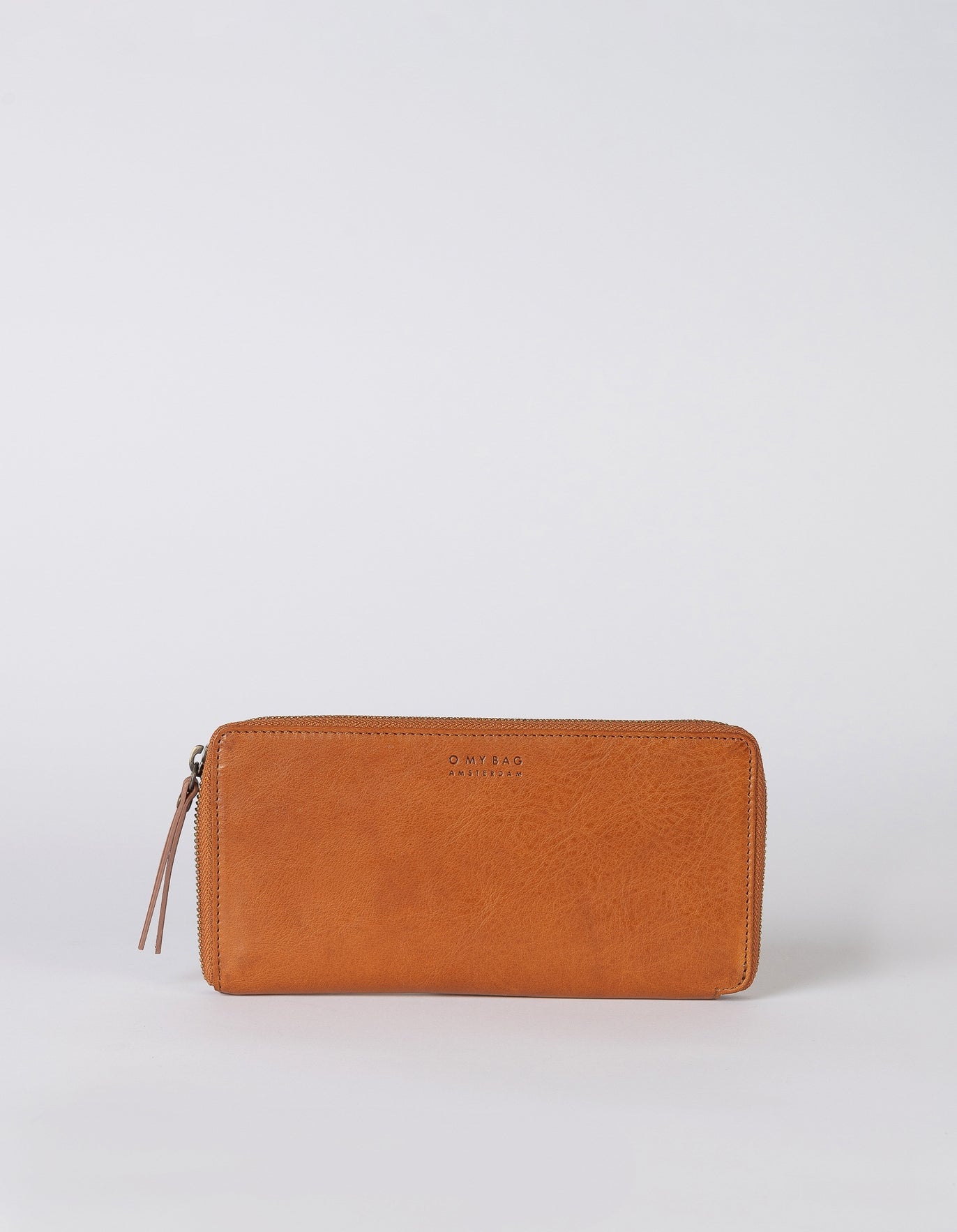 This easy zipper round wallet is handcrafted with eco-friendly and lively Stromboli Leather.

The Sonny Wallet has the perfect in-wallet organization: its zipper around closure provides quick and easy access to the items you need the most and its interior zipper pocket provides slim storage for the items you don't use as often.