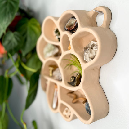 The Cave of Inspiration was designed to encourage a connection with nature and the exploration of the outdoors. It makes the perfect home for crystals, pinecones, rocks, air plants and other tiny treasures.