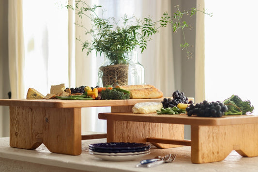 Natural Grazing Footed Boards add height and texture to any tabletop.

Handcrafted from reclaimed pine wood, this rustic riser is designed for serving charcuterie or for displaying decorative accents.