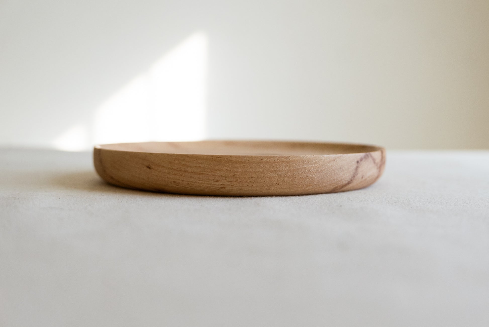 Handcrafted round light wood catchall dish a great spot to place your jewelry or keys. 6” solid rustic light hickory finished with food grade oil & wax. All timbermade items are handmade by jon & bre in their ND shop.