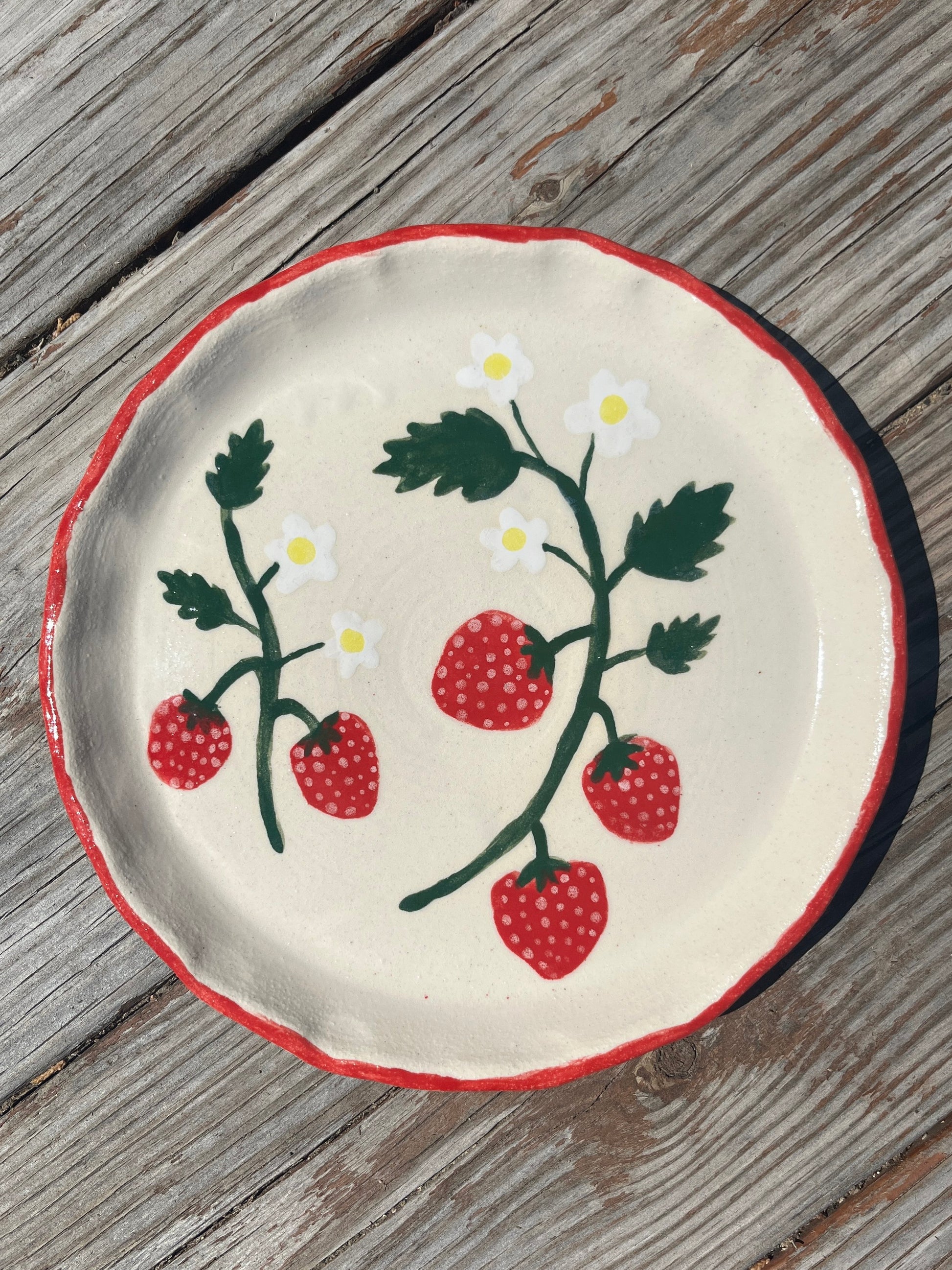 Strawberries salad/lunch plate by ninth house goods. A hand-painted lunch plate designed for your spring and summer gatherings. The perfect lunch or salad plate for your fresh harvests. Your new go-to to impress guests at your home. Wheel-thrown white clay with clear glaze.