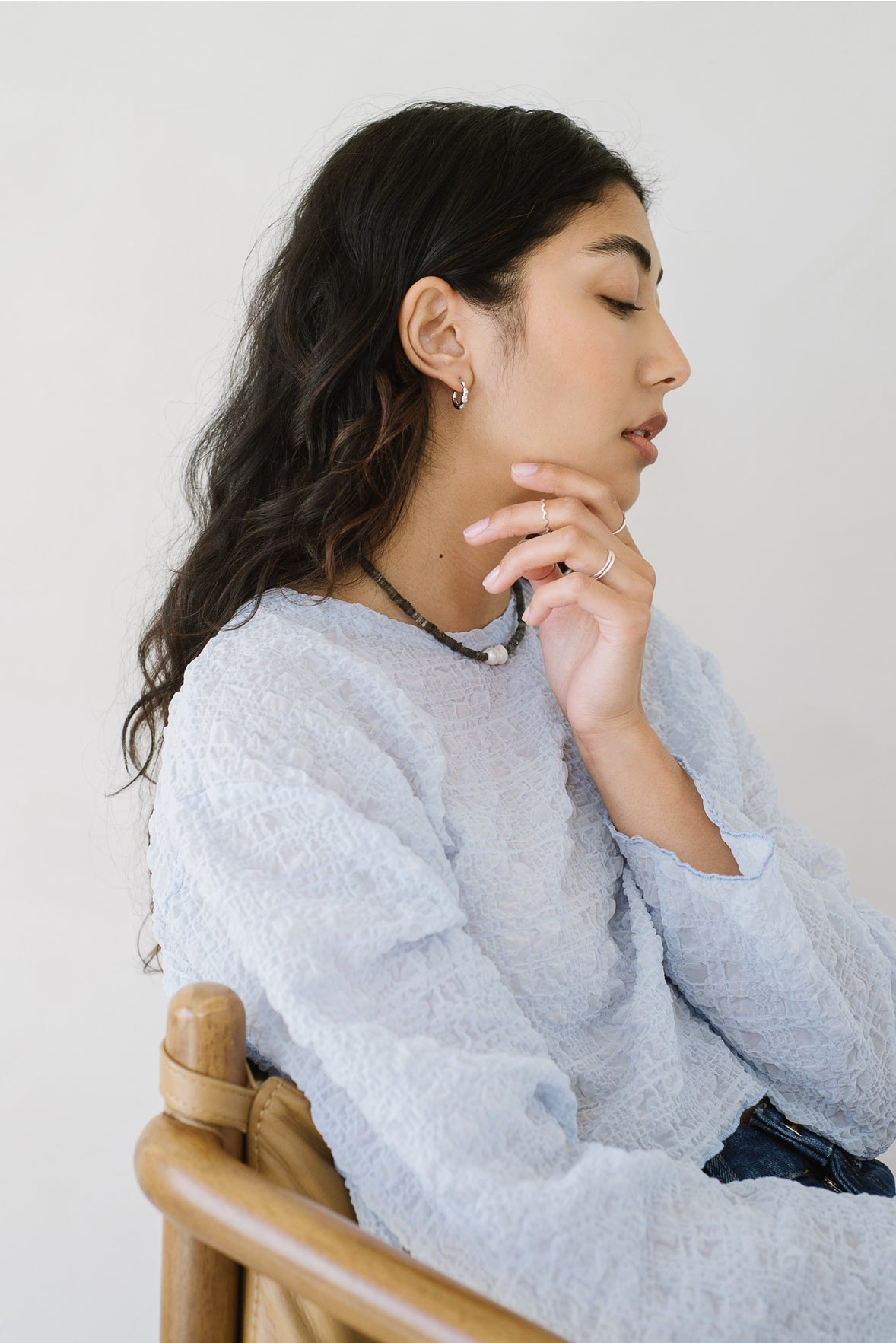 A medium-sized hoop with a nuanced organic structure. Handcast in sterling silver or gold vermeil by Kara Yoo.