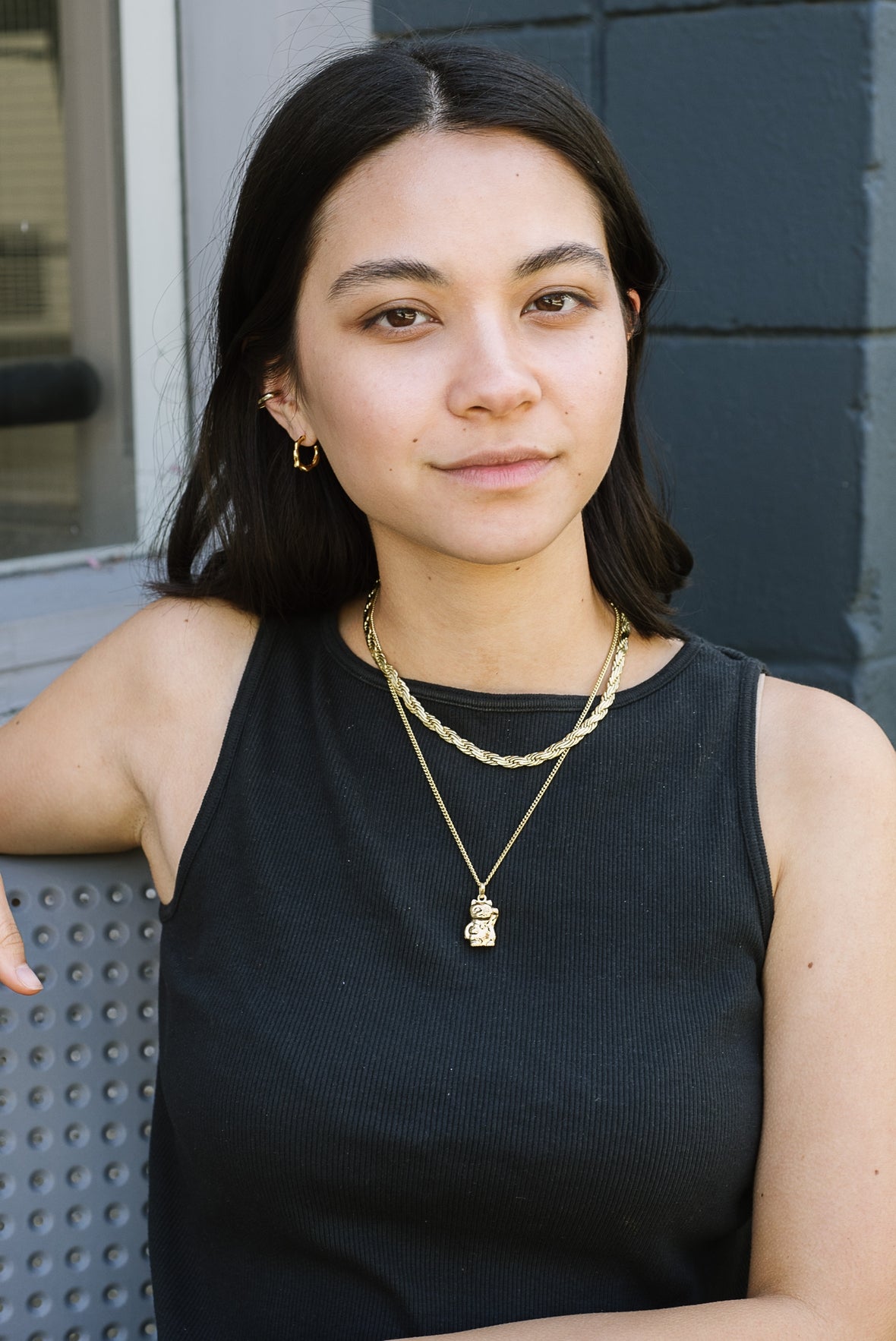 A medium-sized hoop with a nuanced organic structure. Handcast in sterling silver or gold vermeil by Kara Yoo.