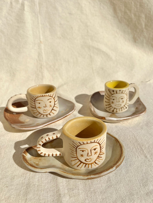 Little cups & saucer set for your espresso moments! Hand built, glazed and fired in slo, ca by roaming barefoot ceramics.
