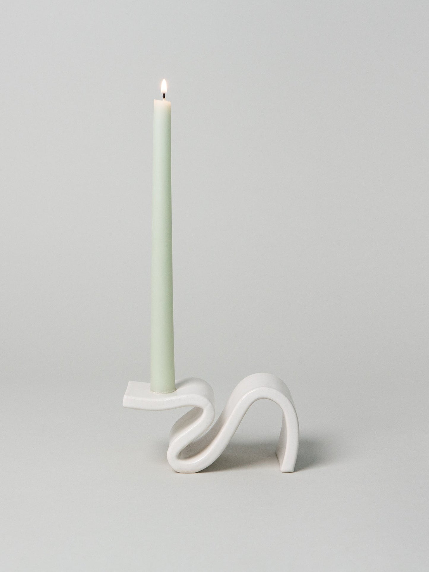 Introducing Wei, a candlestick designed to evoke the romance of a foregone era. This unique piece combines elements of classic design with a modern twist. Its cantilevered surface pays homage to contemporary architecture, seamlessly blending tradition with innovation. Handmade in Brooklyn, NY.