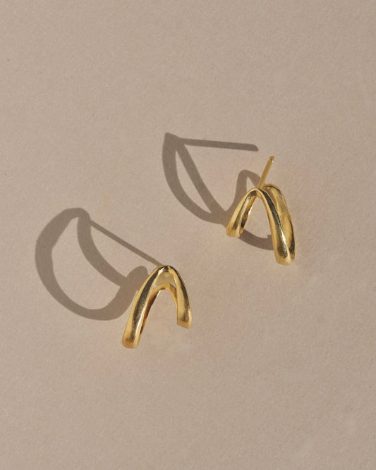 Mountainside Siempre Earrings - Asymmetrical mythical mystical hoop earrings for anytime and anywhere. Inspired by the curvature of a slowly growing vine. Intended to curve around the ear for a unique illusion. Handmade in the Santa Cruz Mountains.
