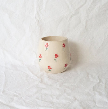 A handmade ceramic cup designed to emulate a stemless wine glass.&nbsp;This softly rounded cup is the perfect vessel for your beverage of choice-- coffee, tea, perrier, and of course wine. Made with food safe ceramic materials and painted by hand.