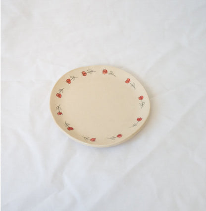 Handmade ceramic catchall plate perfect for organizing small household items, a spoon rest in the kitchen, a slice of pie, or as a home for your favorite jewelry.

Thoughtfully sculpted, painted, and glazed by hand with food safe ceramic materials. Handmade in the US.