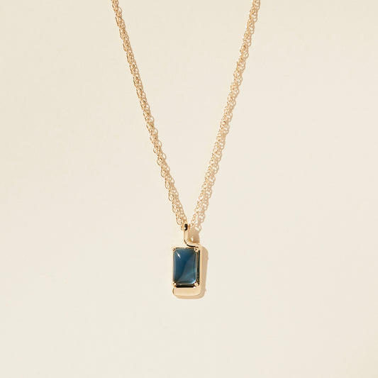 Lindsay Lewis Foster Necklace. A beautiful blue cabochon is set into this asymmetrical pendant in a sophisticated and modern necklace.