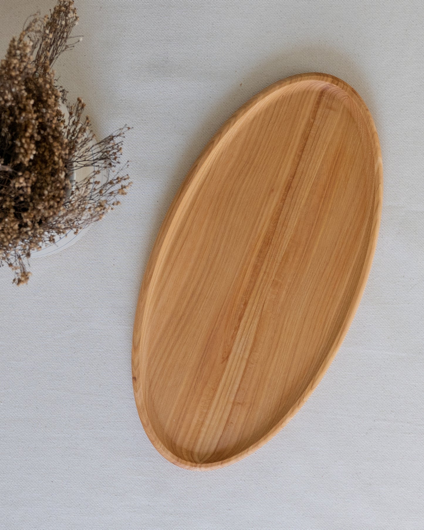 A classic in serving ware, the Hilda platter is a staple for hosting dinner parties and holidays. Handcrafted from mid-tone hickory wood. All Timbermade items are designed and handcrafted by Jon & Bre in their ND shop