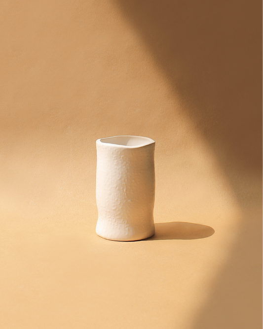 The minimal design of these pieces creates moments for diverse usability such as flower vase, pen stand, drinking vessel, or collectible’s container. Handmade in India.