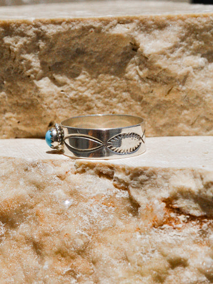 Silver and turquoise Navajo-made ring from second generation silversmith