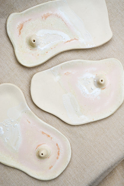 Hand built incense dishes made out of recycled clay. They're sanded smooth underneath and are partially dipped in a non-toxic glaze which highlights the raw clay. They also work great for holding rings, jewelry, or other treasured items. Due to the nature of handmade work, no two pieces are alike.