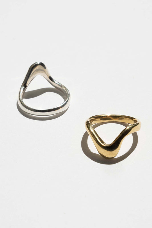 The High Tide ring is inspired by the movement of rising water.  Hand carved and cast with a high polished mirror finish. Available in solid brass or sterling silver.