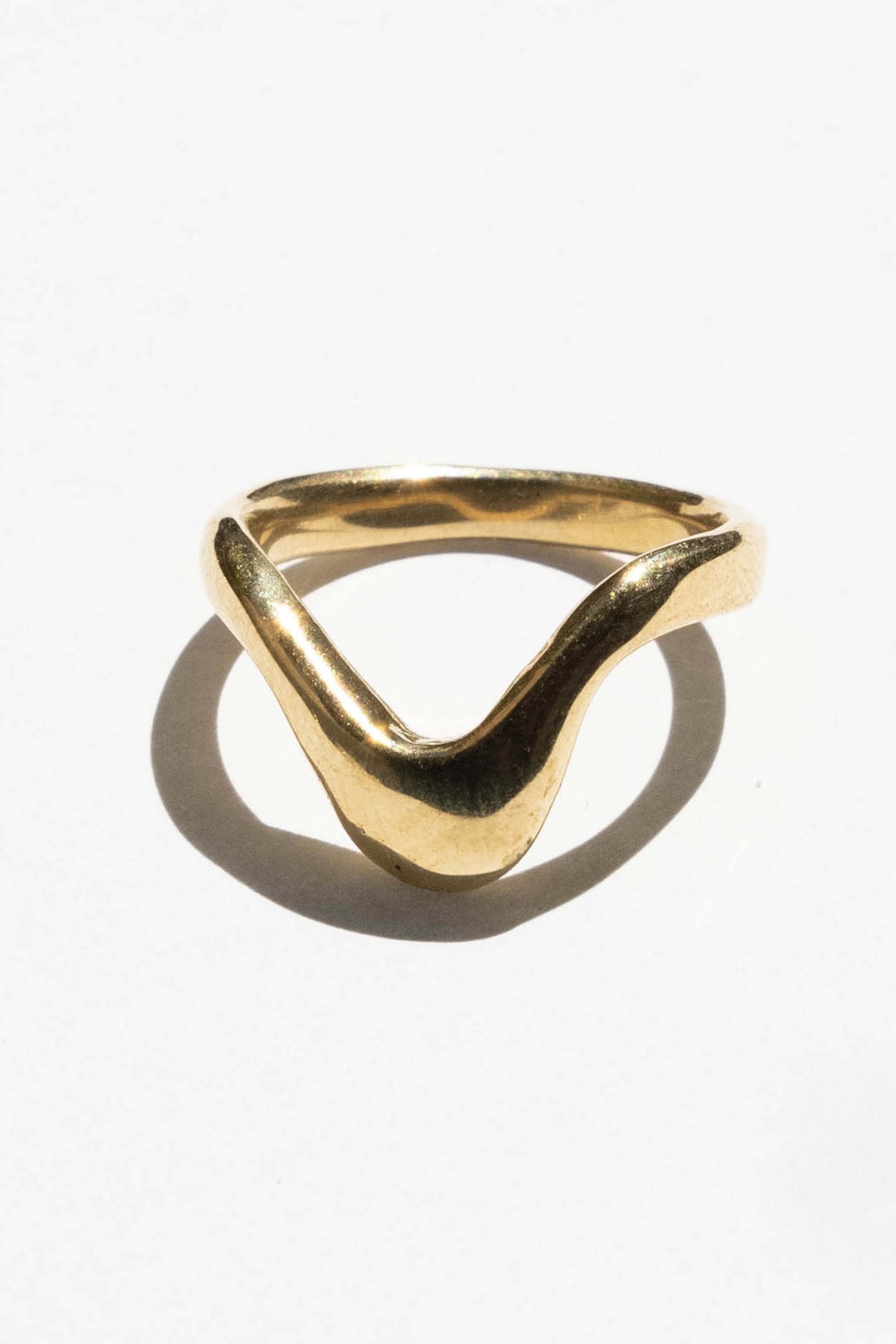 The High Tide ring is inspired by the movement of rising water.  Hand carved and cast with a high polished mirror finish. Available in solid brass or sterling silver.