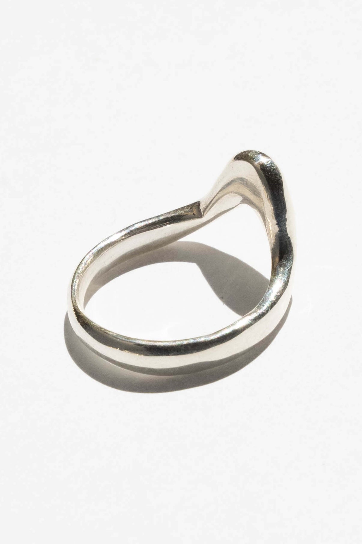 The High Tide ring is inspired by the movement of rising water.  Hand carved and cast with a high polished mirror finish. Available in solid brass or sterling silver.