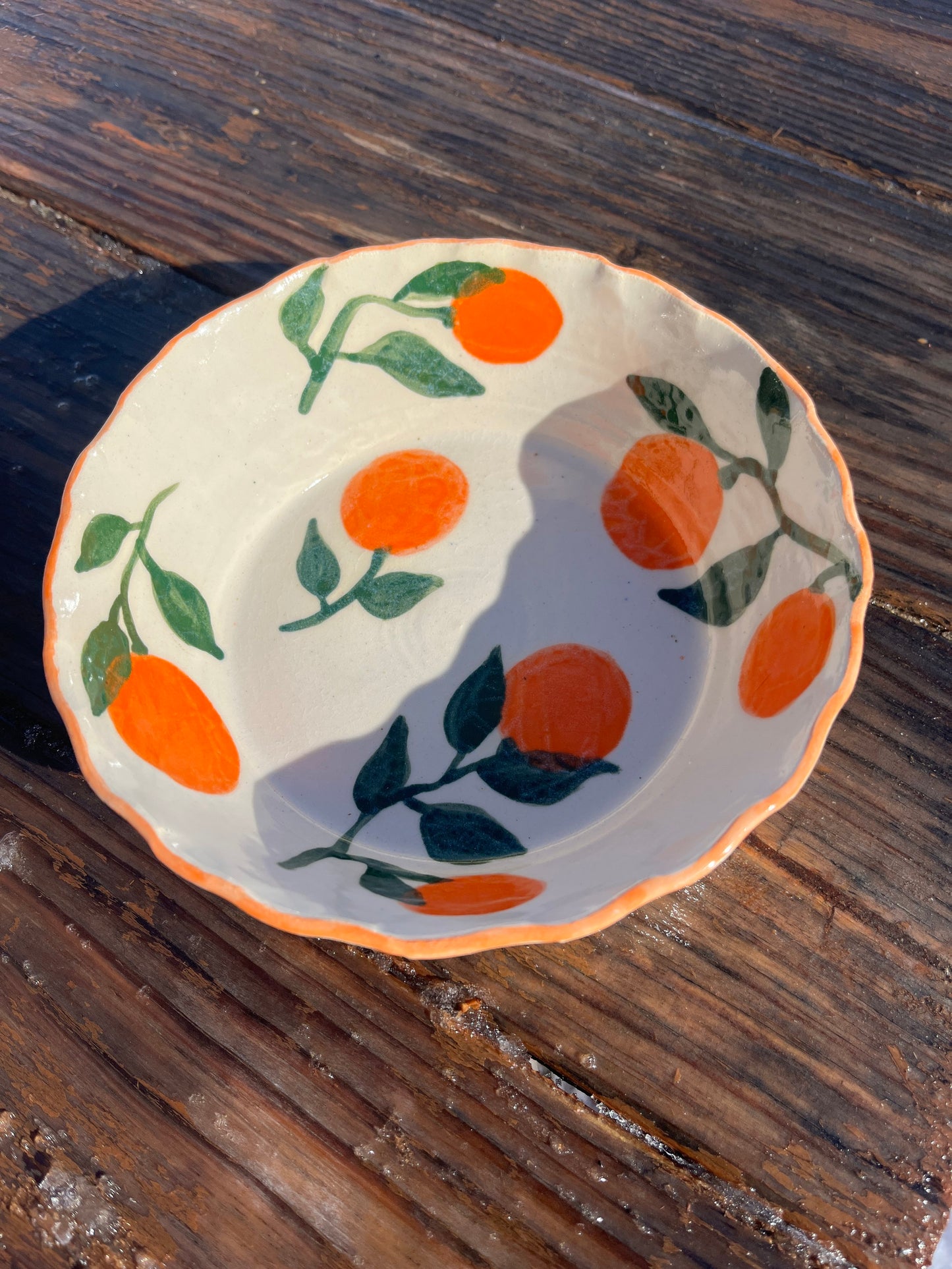 Manadarins pasta bowl by ninth house goods. A hand-painted bowl designed for your spring and summer gatherings. The perfect salad or pasta bowl for your fresh harvests. Your new go-to to impress guests at your home. Wheel-thrown white clay with clear glaze.