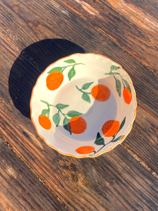 Manadarins pasta bowl by ninth house goods. A hand-painted bowl designed for your spring and summer gatherings. The perfect salad or pasta bowl for your fresh harvests. Your new go-to to impress guests at your home. Wheel-thrown white clay with clear glaze.