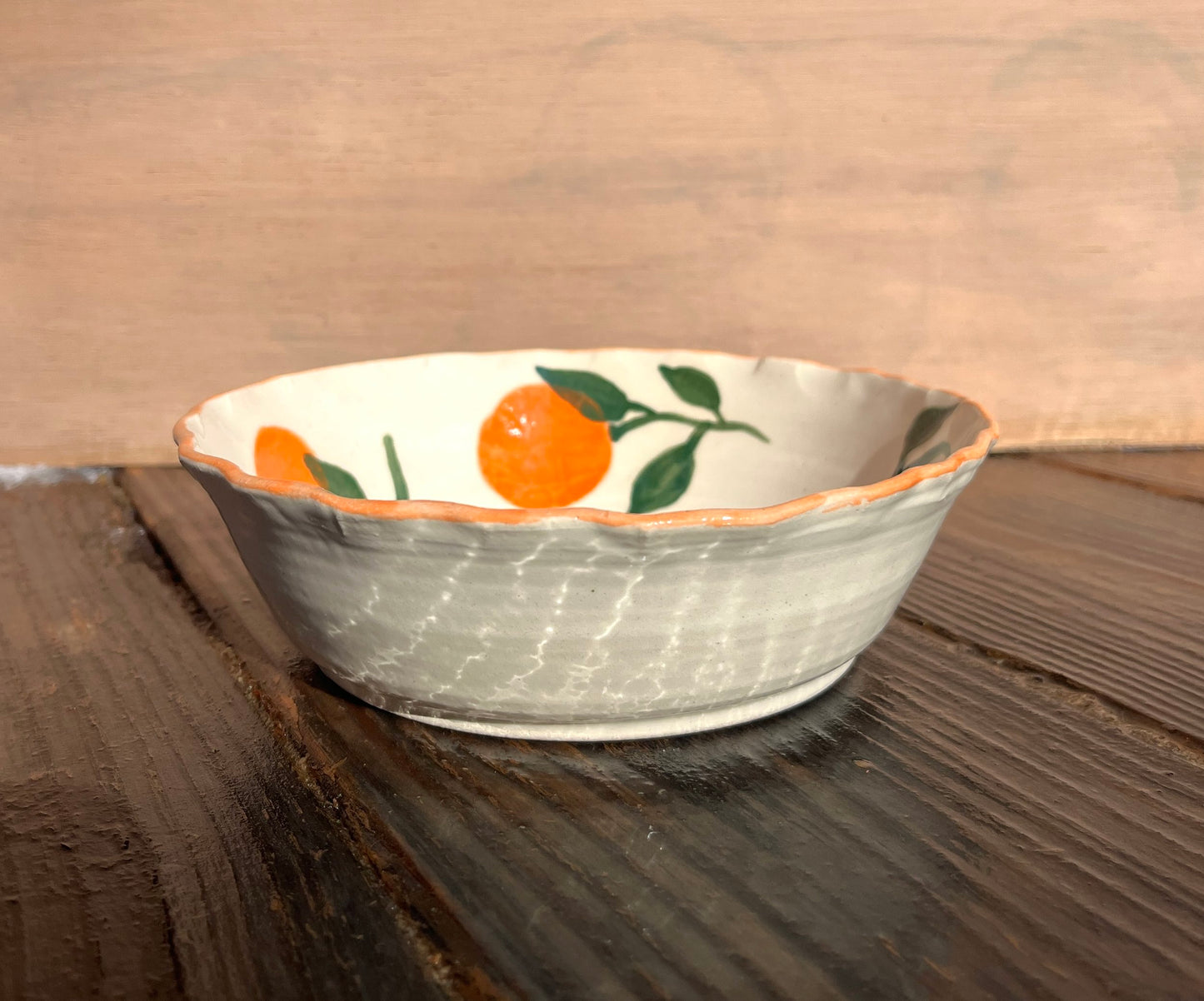 Manadarins pasta bowl by ninth house goods. A hand-painted bowl designed for your spring and summer gatherings. The perfect salad or pasta bowl for your fresh harvests. Your new go-to to impress guests at your home. Wheel-thrown white clay with clear glaze.