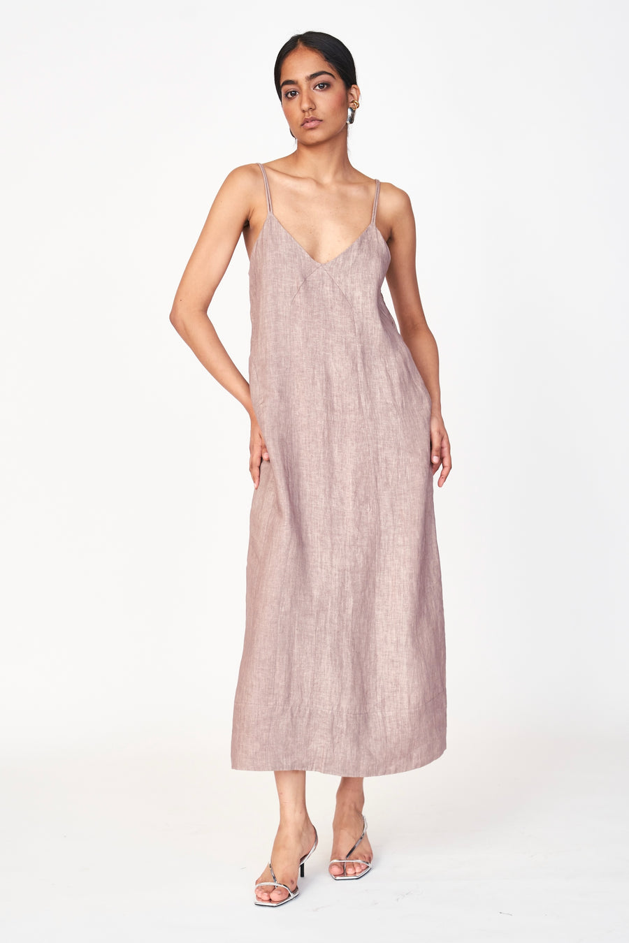 An easy, 100% linen slip dress with a straight fit and deep V neckline for an effortlessly beautiful look. Oh, and it has pockets! Ethically made in India.