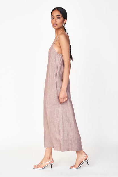 An easy, 100% linen slip dress with a straight fit and deep V neckline for an effortlessly beautiful look. Oh, and it has pockets! Ethically made in India.