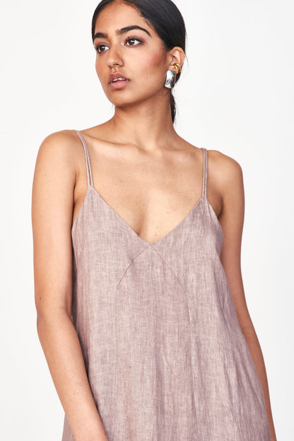 An easy, 100% linen slip dress with a straight fit and deep V neckline for an effortlessly beautiful look. Oh, and it has pockets! Ethically made in India.