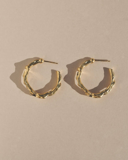 Edgy and modern with lots of texture, these hoops are beautiful and easy to wear. Fluid hoop earrings with wavy dimension in the perfect statement size.    Handmade in the Santa Cruz Mountains.