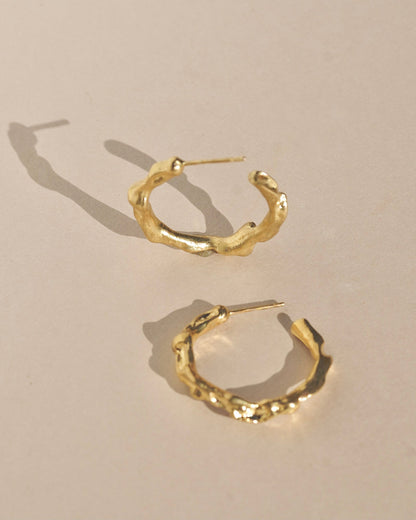 Edgy and modern with lots of texture, these hoops are beautiful and easy to wear. Fluid hoop earrings with wavy dimension in the perfect statement size.    Handmade in the Santa Cruz Mountains.