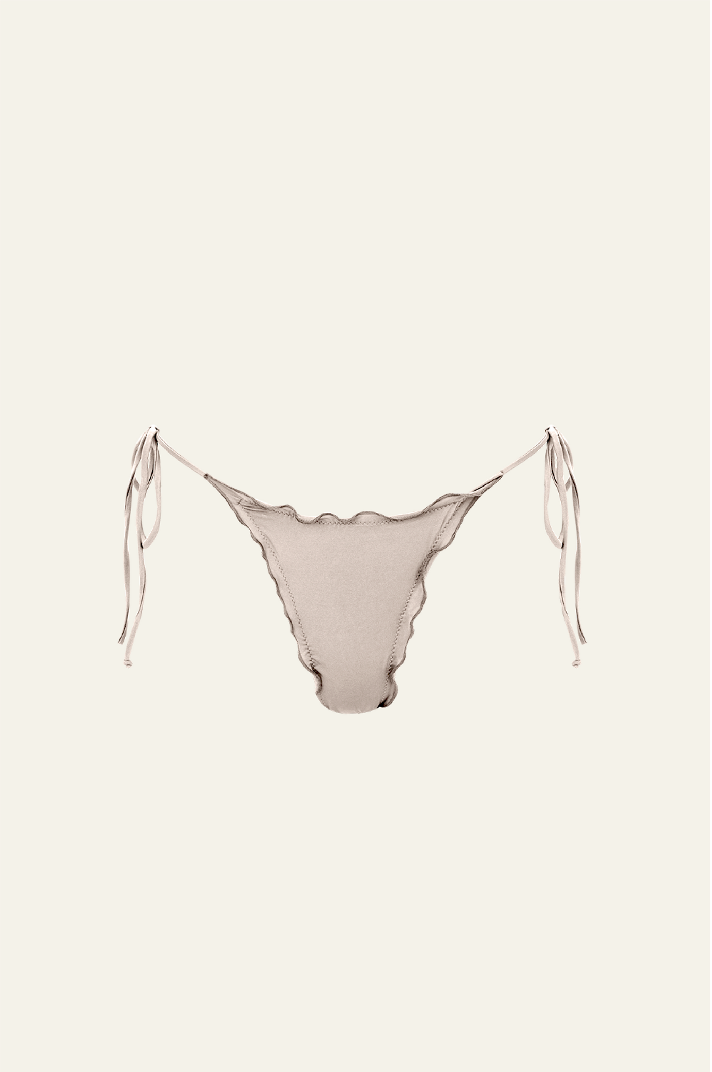 The Melting Bottom features a ruched back with delicate ruffle detail on the sides. This bottom features a cheeky coverage and adjustable side ties for a perfect fit. 88% Recycled Polyamide | 12% Elastane | OKEO TEX Standard - Designed & crafted in Barcelona, Spain.