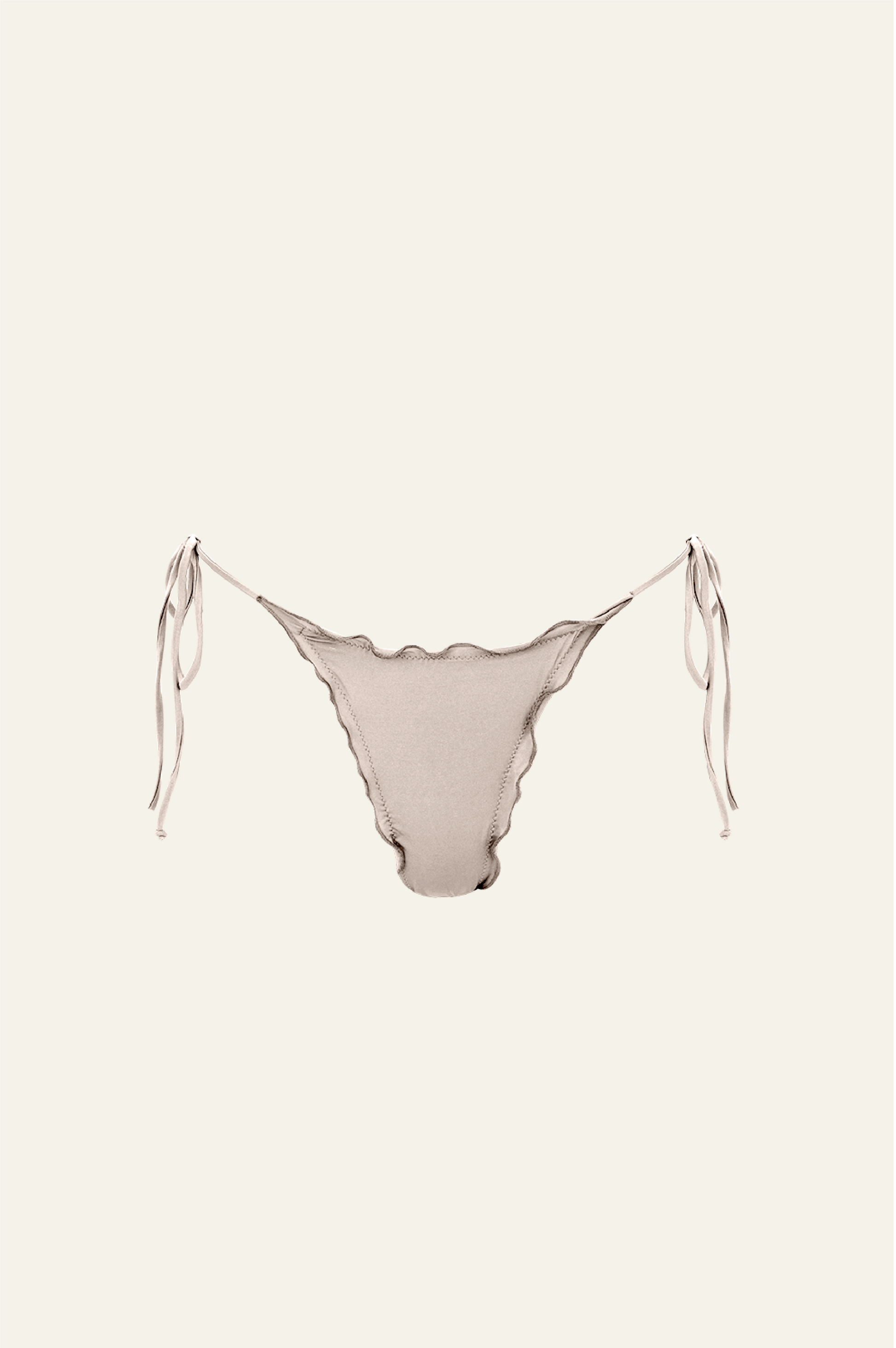 The Melting Bottom features a ruched back with delicate ruffle detail on the sides. This bottom features a cheeky coverage and adjustable side ties for a perfect fit. 88% Recycled Polyamide | 12% Elastane | OKEO TEX Standard - Designed & crafted in Barcelona, Spain.