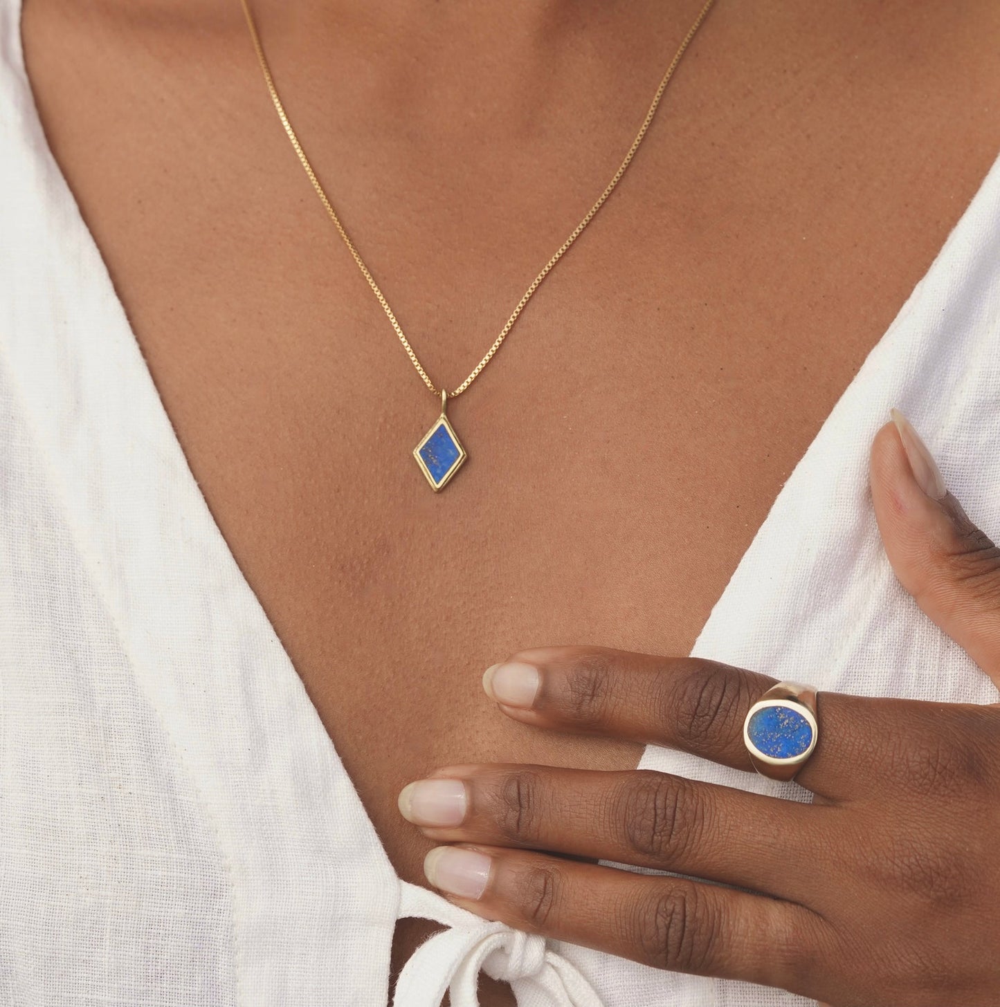 This genuine stone pendant necklace is a diamond-shaped, hand cut stone which is set in a slightly asymmetrical abstract and imperfect metal frame for an organic rustic style. Brass & gold filled. Handmade in the Santa Cruz Mountains.