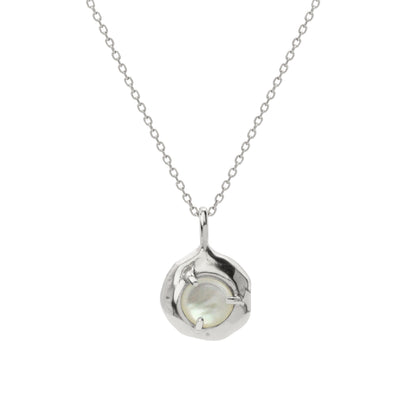 Nestled delicately within the organically shaped three-pronged Keeper pendant, the Mother of Pearl radiates its tranquil aura. Handmade in Northern California by Amanda Hunt.