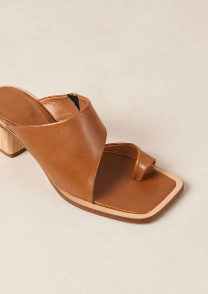 With only a toe ring and front strap, the Josie sandals slip on with ease like a mule. Crafted from brown leather, they have wood-style block heels as well as padded insoles for cushioning and comfort.  Sustainably made in Portugal, designed in Barcelona.