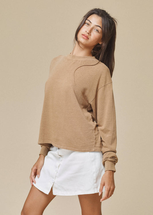 Inspired by 90's band tees and cropped to the perfect length for pairing with high-waisted bottoms. The slightly relaxed fit makes it the perfect comfy + chic layering piece. Made with hemp and cotton in California.