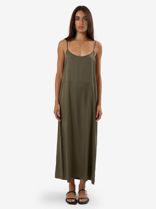 This Breezy Slip Dress in Tarmac makes lounging in style in warm weather a breeze. Super comfy and lightweight, it features an exaggerated silhouette inspired by the baggy appeal of the 90s while the thin, delicate straps balance the casual look with a touch of femininity.  Designed in Byron Bay, Australia.