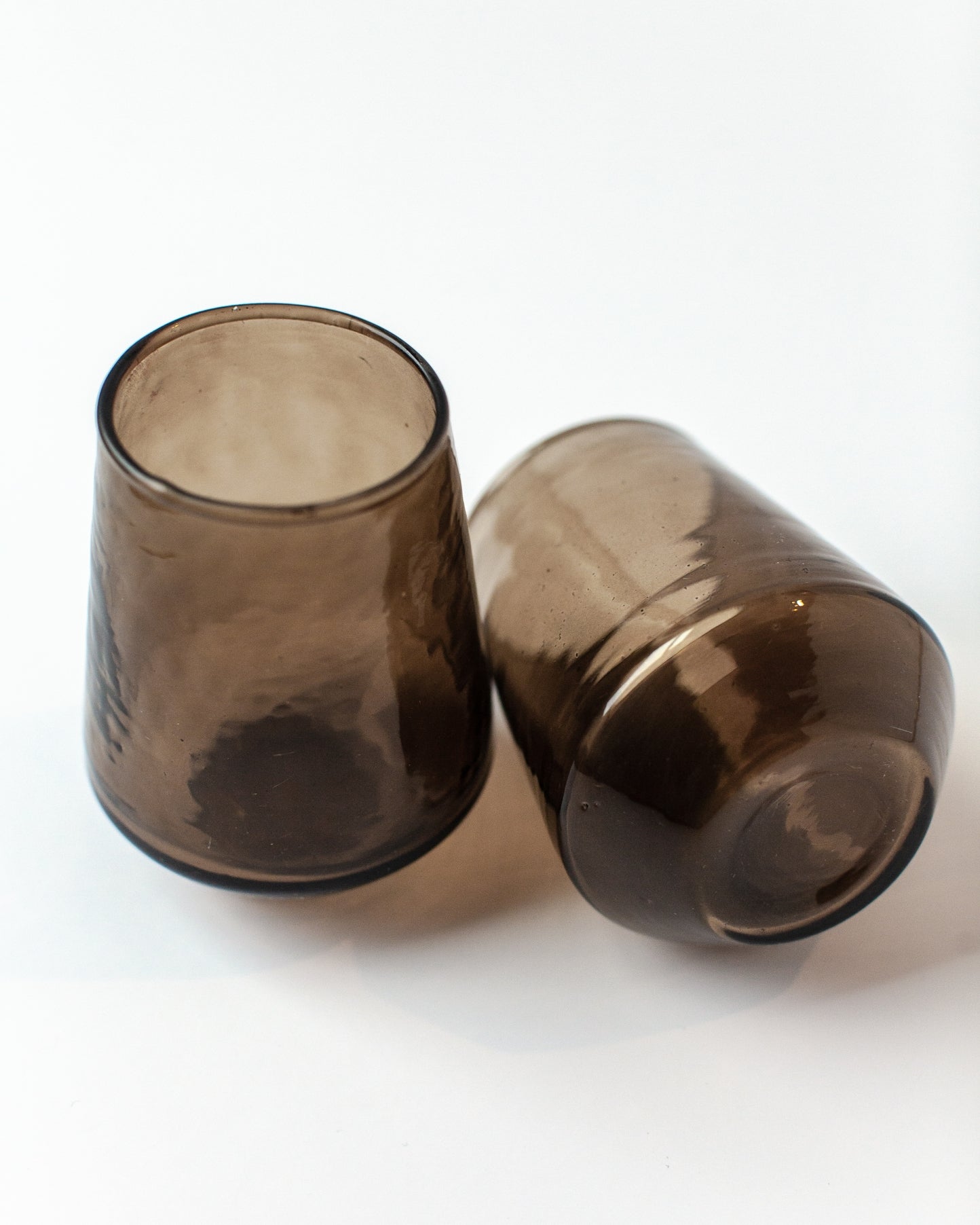 Sip in style with these handblown hammered glass tumblers. Handcrafted from 100% recycled colored glass.