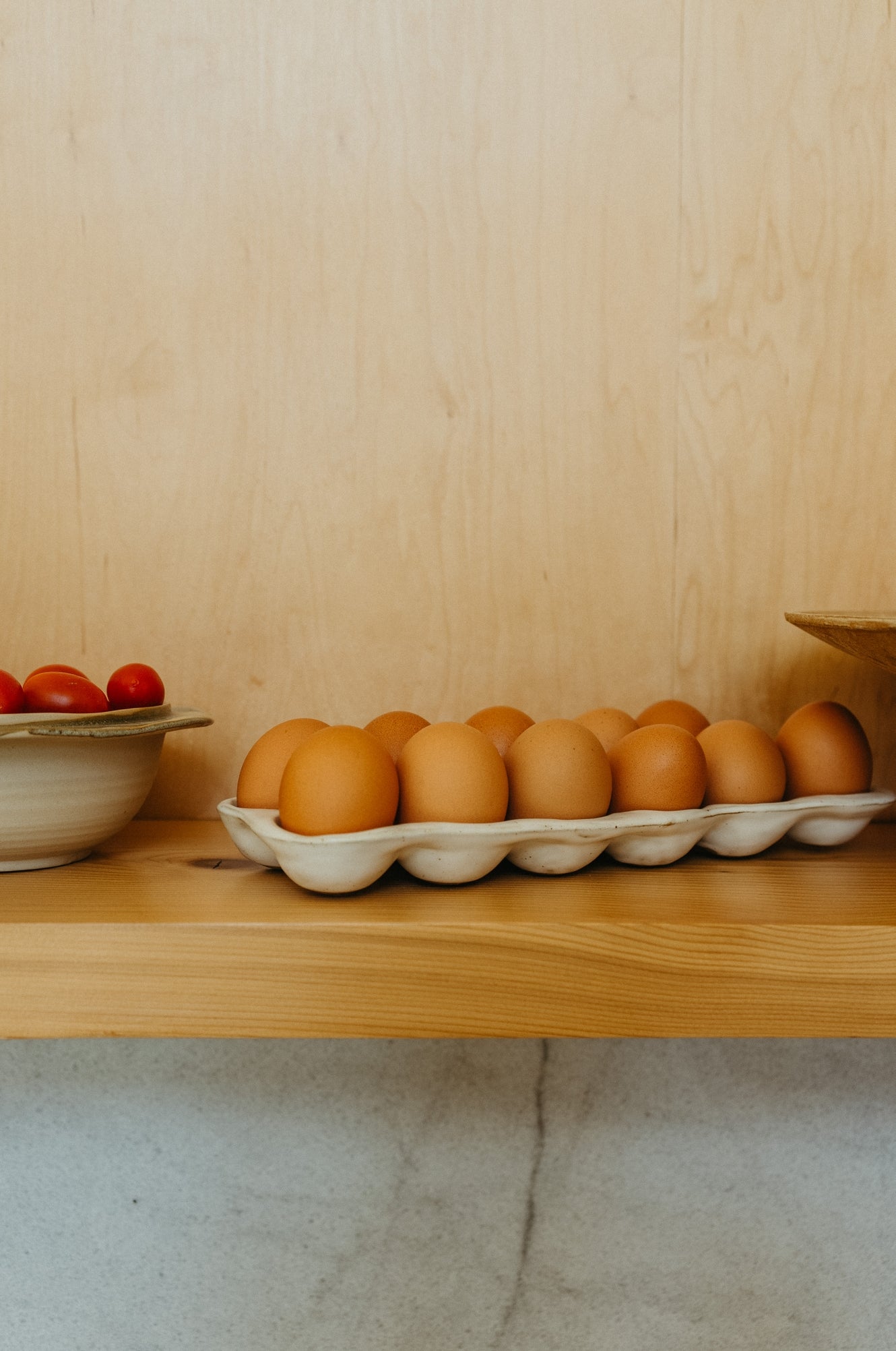 indaba ceramic homestead egg holder / With organic, wabi-sabi inspired shape and reactive speckled glaze, the Homestead Egg Holder offers a stylish spin on a classic egg carton. Whether serving hard-boiled eggs for breakfast or storing fresh eggs in the fridge or on the countertop, it’s a must have accessory for any home baker or chef.