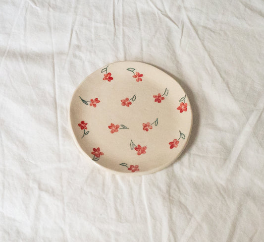 Handmade ceramic catchall plate perfect for organizing small household items, a spoon rest in the kitchen, a slice of pie, or as a home for your favorite jewelry.

Thoughtfully sculpted, painted, and glazed by hand with food safe ceramic materials.