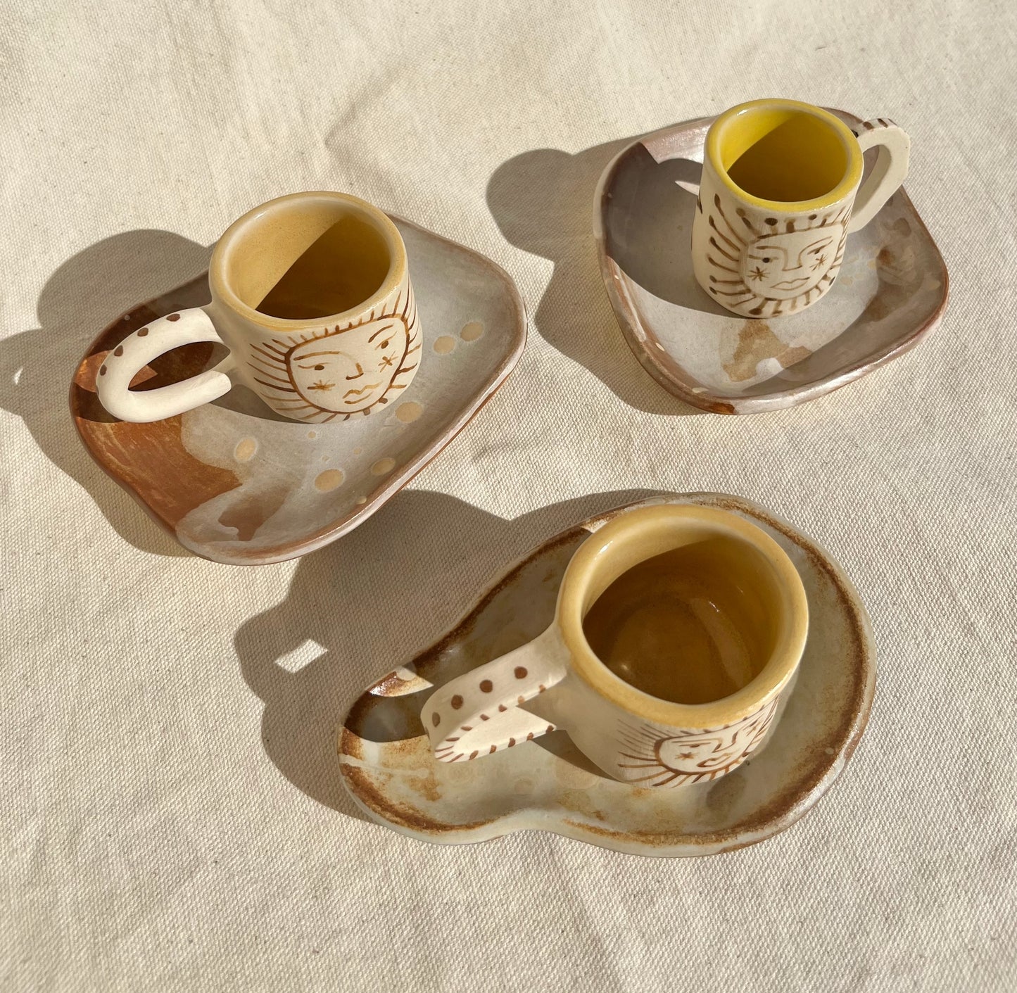 Little cups & saucer set for your espresso moments! Hand built, glazed and fired in slo, ca by roaming barefoot ceramics.
