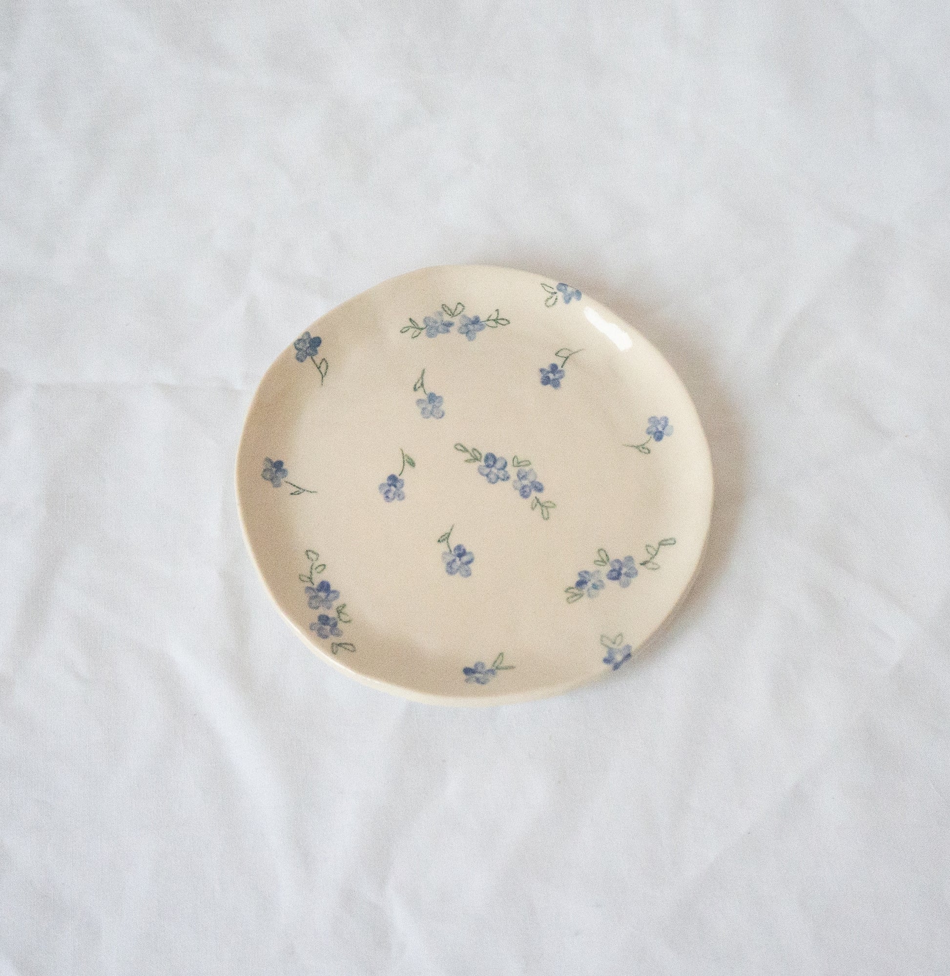 Handmade ceramic catchall plate perfect for organizing small household items, a spoon rest in the kitchen, a slice of pie, or as a home for your favorite jewelry.