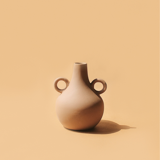 Crafted by skilled local potters, these vases offer a contemporary twist to the traditional Harappan vessels, showcasing unique sculptural designs. Handmade in India.