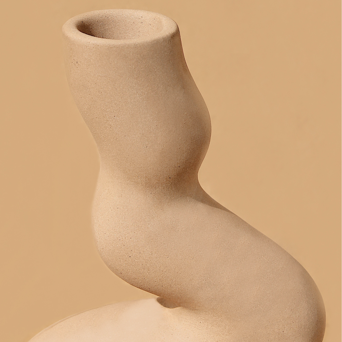 A captivating conversation starter with its unique shape,  this sleek and tall holder adds a touch of sophistication. Handmade in India. 