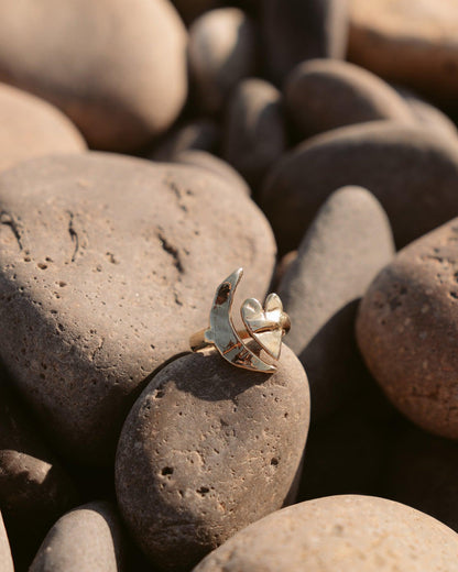 dea dia artemis moon & heart ring / Paying homage to the goddess of the hunt and the moon, Artemis, this meticulously handmade piece showcases delightful texture and shine. Its adjustable design, adorned with crescent moon and heart motifs, renders a timeless charm with a hint of whimsy. Handmade with recycled brass in Downtown Los Angeles.